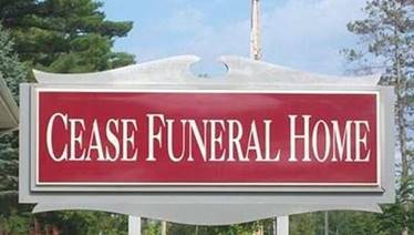 A sign for Cease Funeral Home