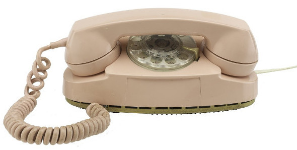 A pink phone where the 
receiver sits directly above the rotary dial, such that you can't dial until you pick up the receiver.