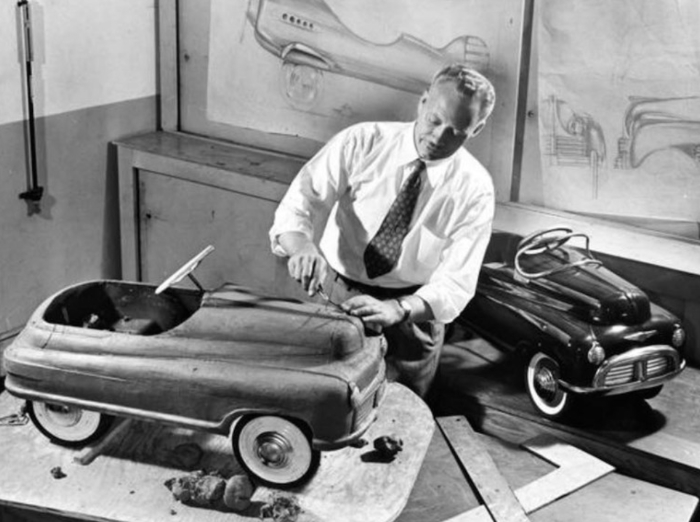 Schreckengost works on two pedal 
cars that have a lot of rounded corners, and big whitewall tires, and that look very 1940s
