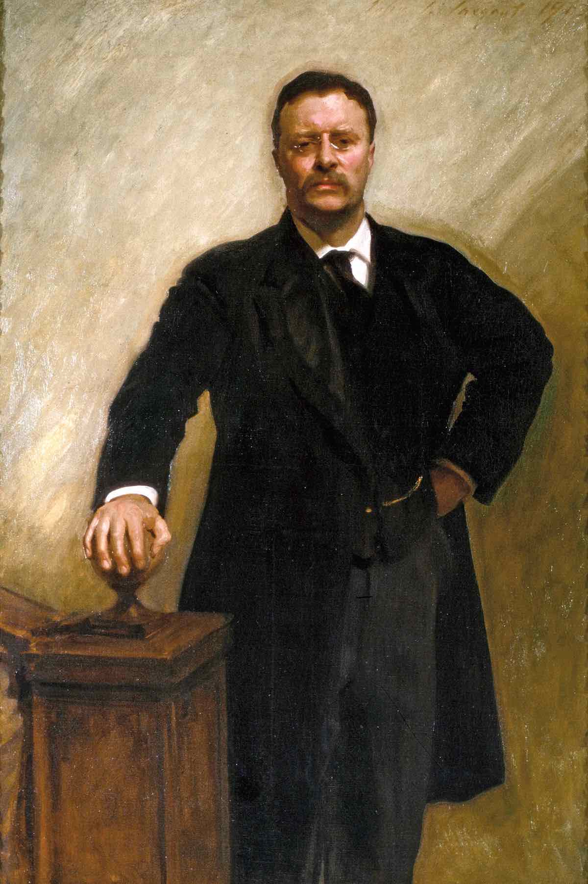 Roosevelt, posed with one
hand on a staircase banister and the other on his hip