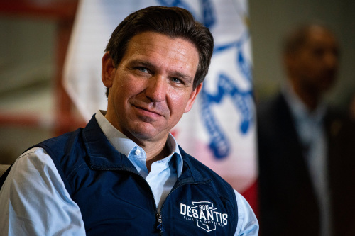 Ron DeSantis in a fleece vest with his logo in the left upper chest area