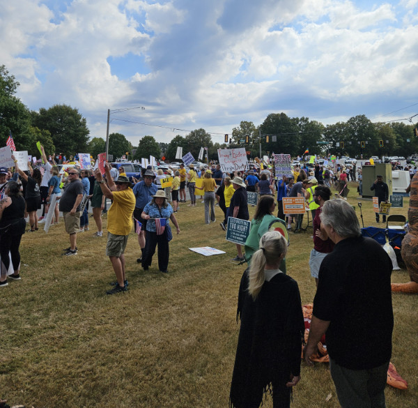 A large group
in an open, grassy area