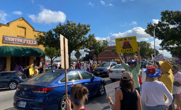 A sizable crowd in
what appears to be the downtown area of Katy