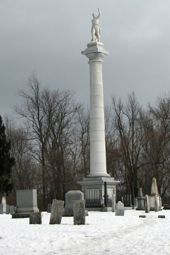 A cemetery, with many
graves, buried in snow