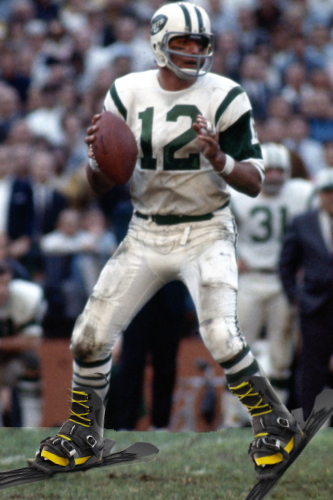 A football player in a
green and white uniform, wearing #12, with ski boots and skis on his feet