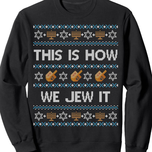 The sweater says 'THIS IS HOW WE JEW IT' and has dreidels, Stars of David and menorahs