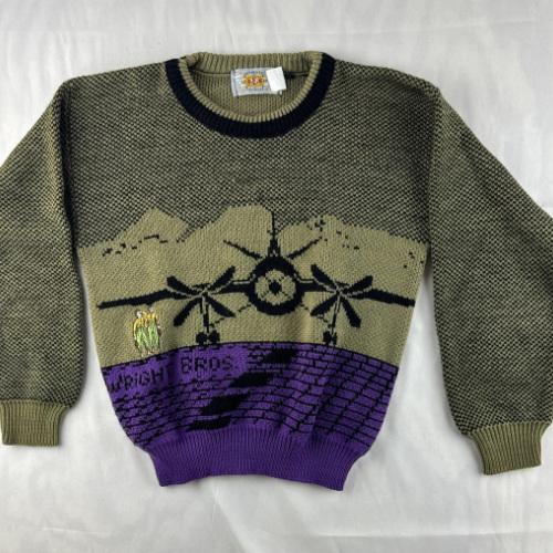 An ugly brown and purple sweater with a drawing of a plane and the words 'Wright Bros.'