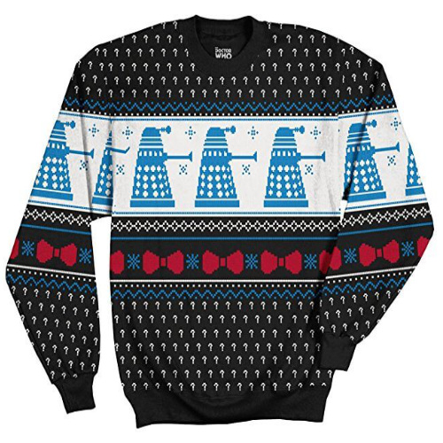 Black background, and a pattern with white question marks. There is a white bar across the sweater, and marching across is something that looks like upside-down snow cones