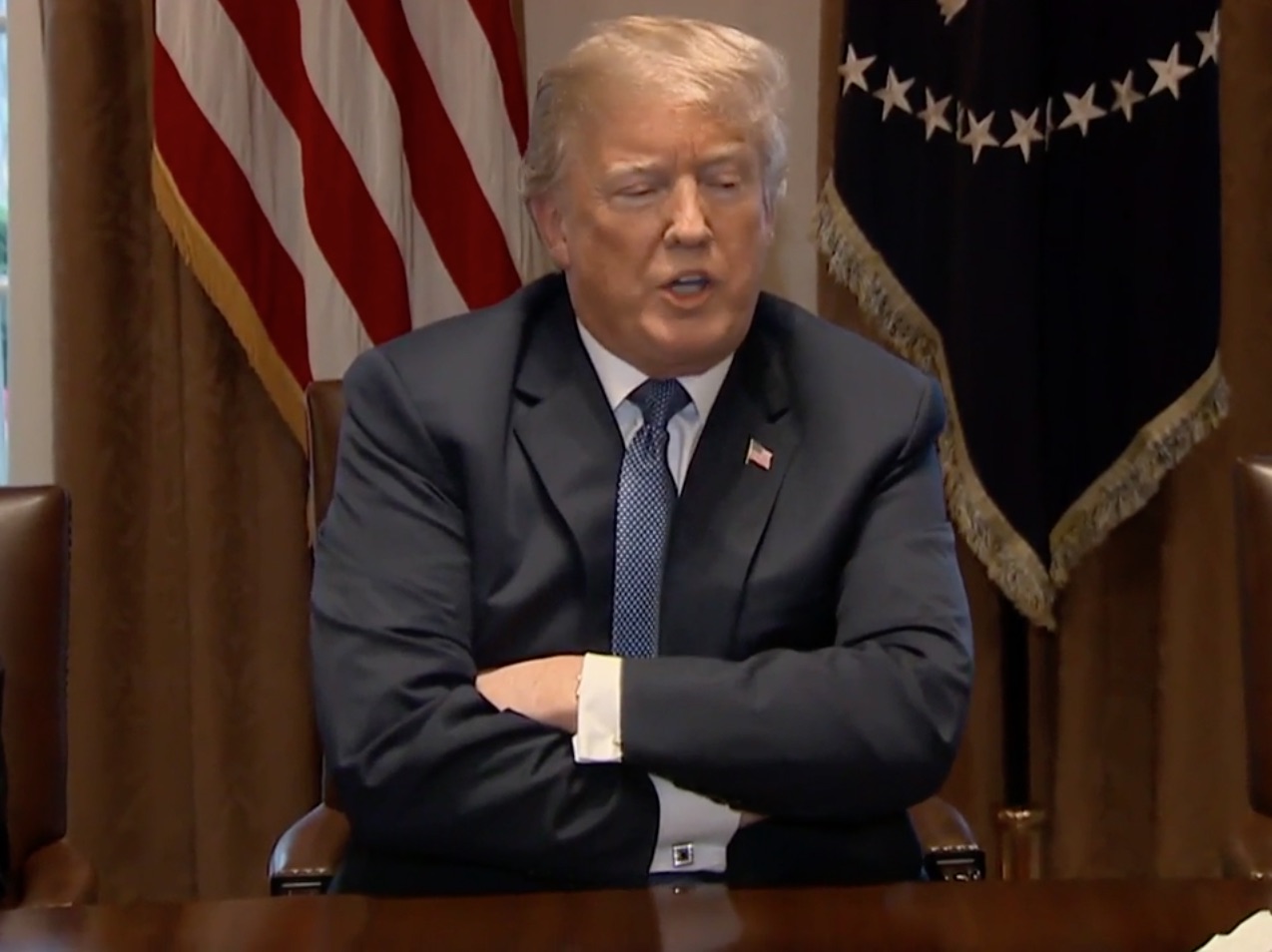 The Donald with crossed arms