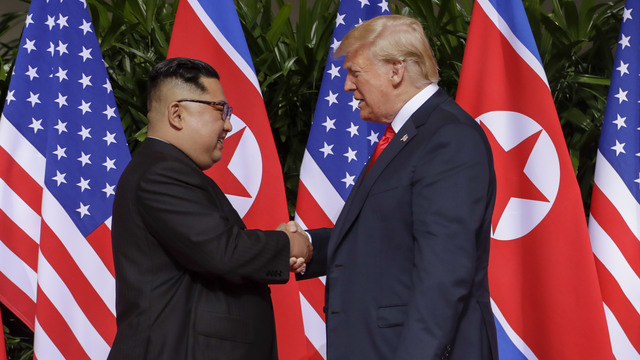 Trump and Kim shake hands