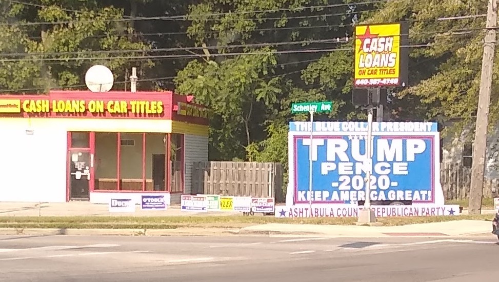 An enormous Donald Trump sign
celebrates him as 'the blue-collar president'