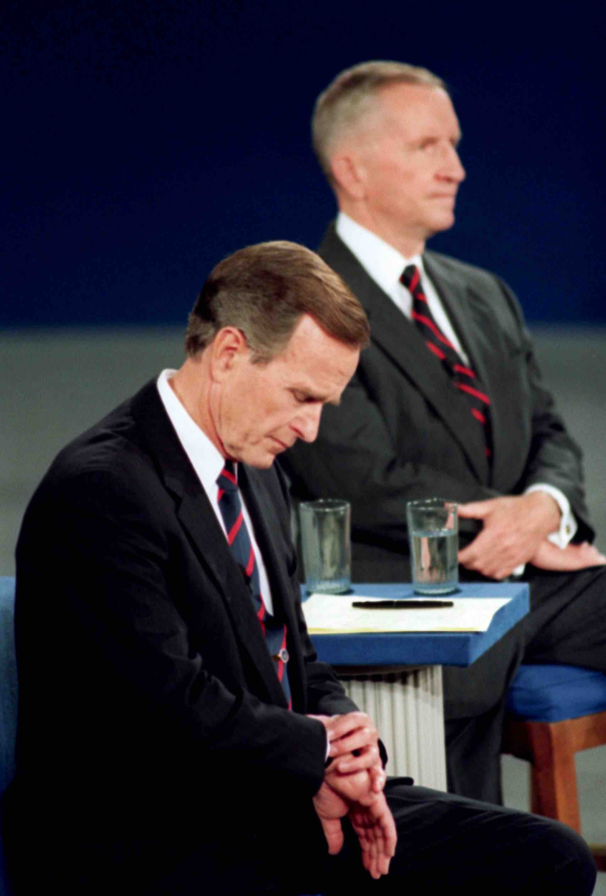 Bush the father glances at his wristwatch during the 1992 presidential debates