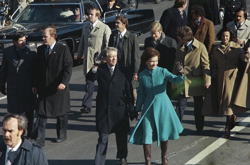 Jimmy and Rosalynn Carter walk part
of their inaugural route on foot