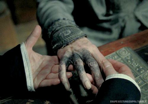 The Harry Potter character's
hand is black and withered