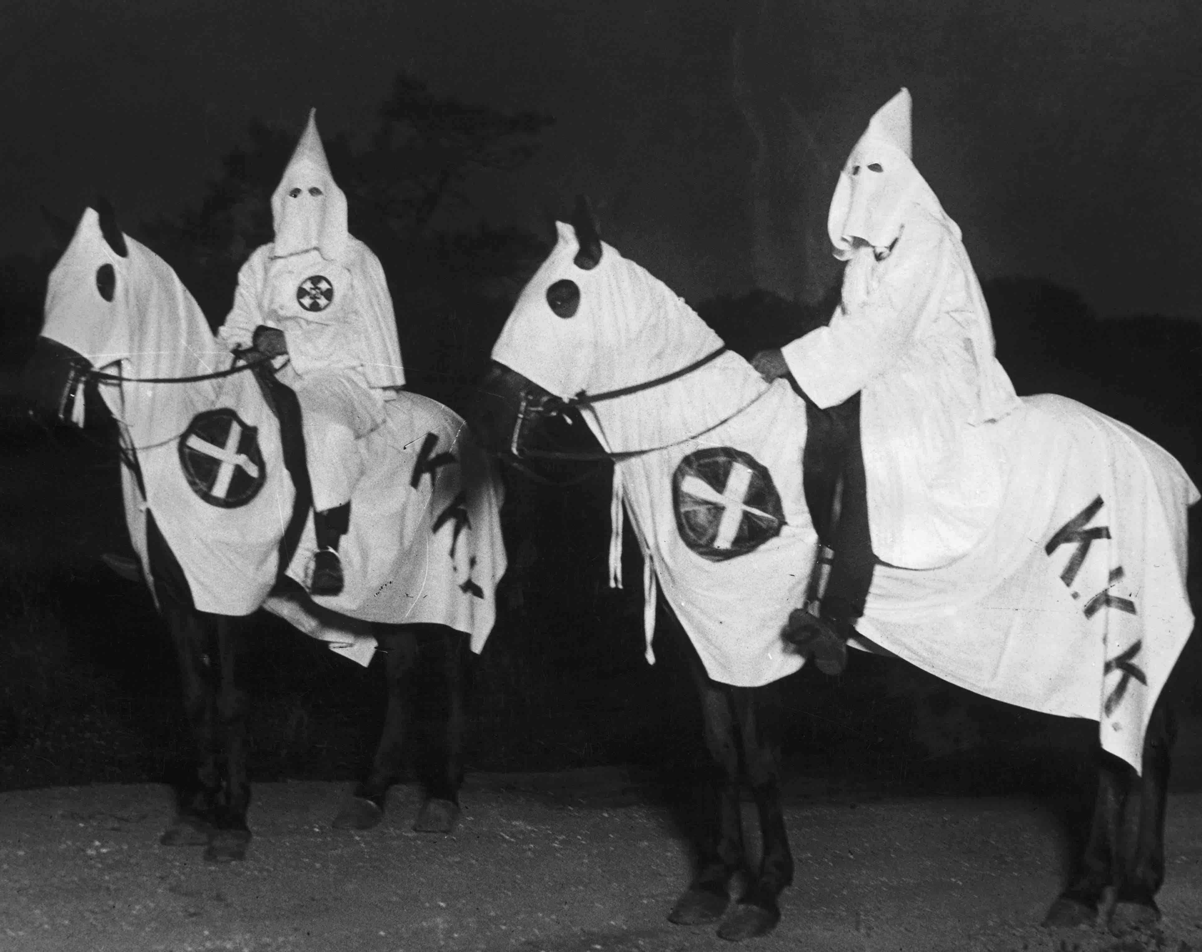 Two Klansmen from the 1920s, with the Crusader
Cross on both their horses' livery and on their Klan robes