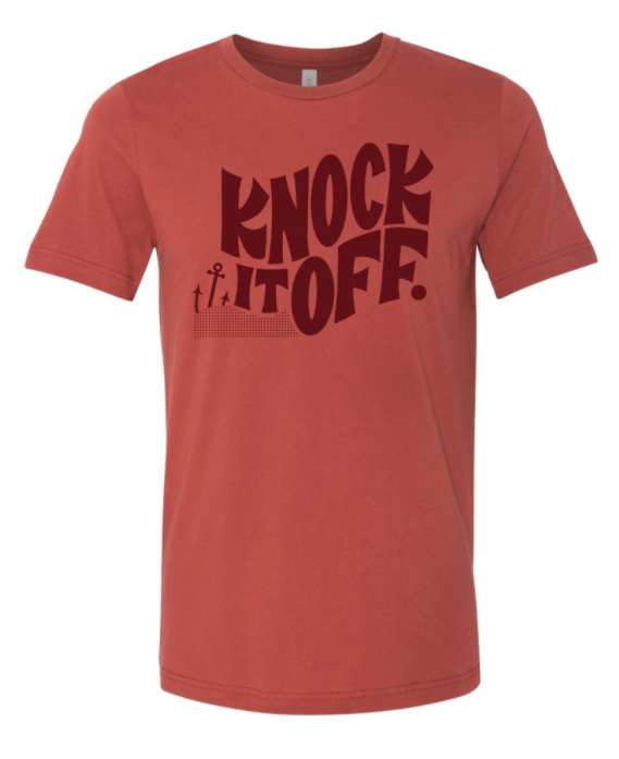 Knock it off is rendered
on the t-shirt in a 1960's-style groovy font, and is situated next to a small anchor as a symbol of Rhode Island