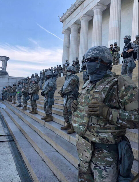 At least 70 men in camouflage
and black masks guard the Lincoln Memorial