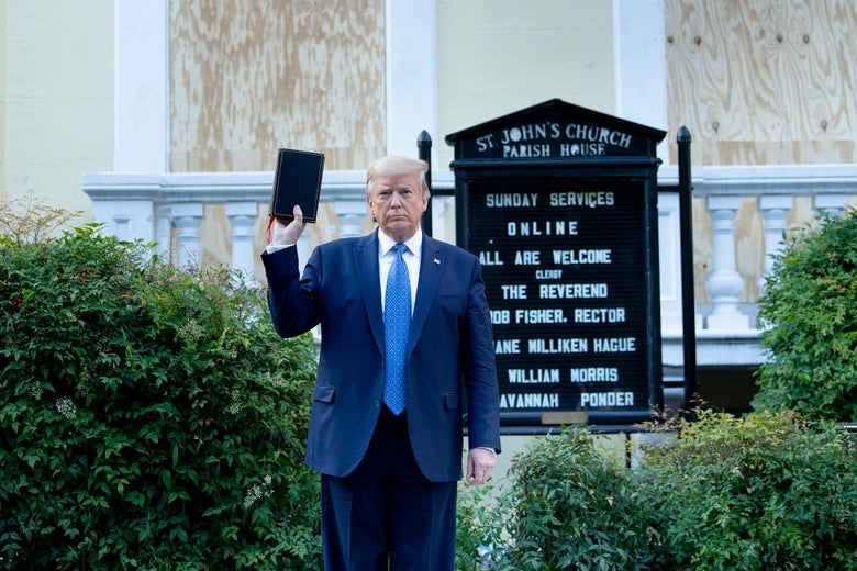 Trump, standing in front of the church,
holds up a Bible with about as little enthusiasm as is possible. He kind of looks like he's hailing a taxi cab.