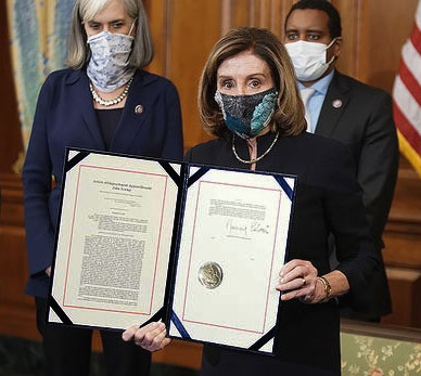 Article of impeachment, being held
by a masked Nancy Pelosi