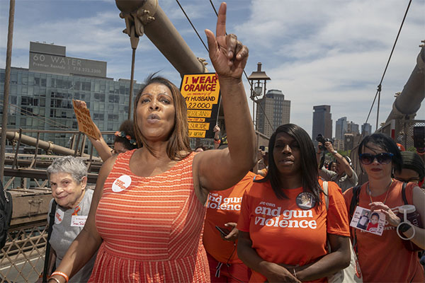 Letitia James leading a protest against gun violence