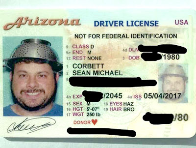 Pastafarian with religious headgear, namely a colander on his head