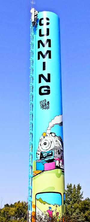 A very tall, very phallic water tower with 
'Cumming' painted on the side.