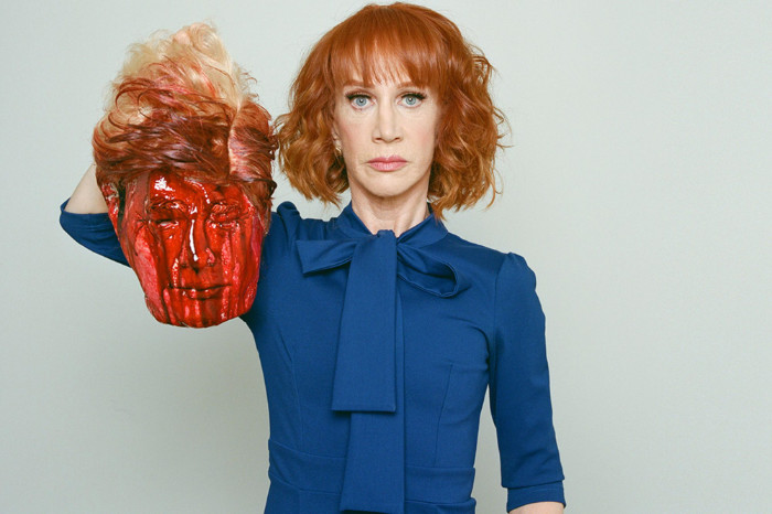 Comedian Kathy Griffin holding a Donald Trump mask covered in blood
along with a knife, making it appear as if she has cut Trump's head off
