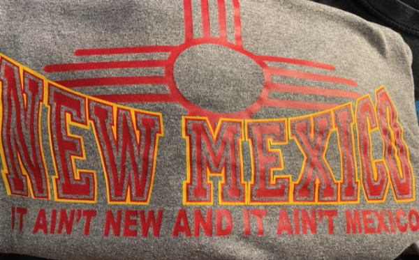 The shirt says 'New Mexico: It ain't new,
and it ain't Mexico'