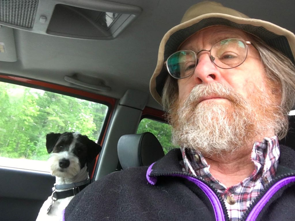 The author of the letter in his car
with his dog, wearing a pork pie-style hat