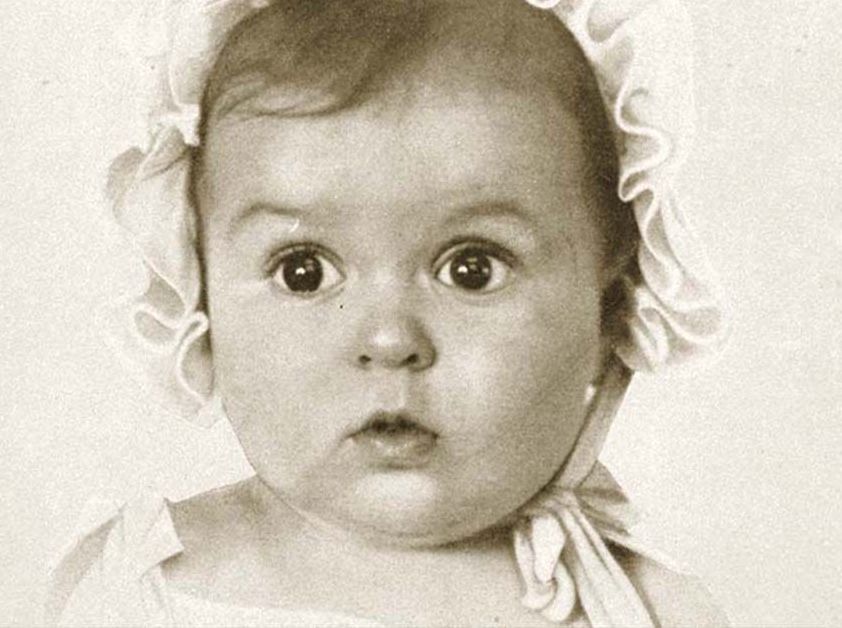 A black and white baby photo