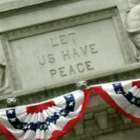 Carved stone that says 'Let Us Have Peace'