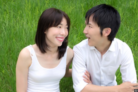 A couple dressed in white