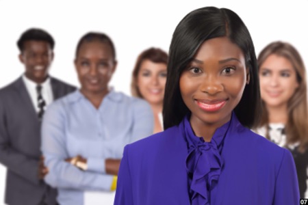 A woman in the foreground with four people in the background