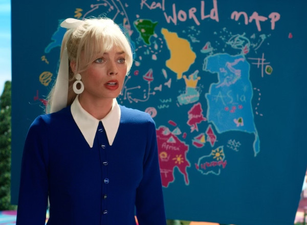 Barbie in front of a map; 
next to a crudely drawn Asia is a dashed line