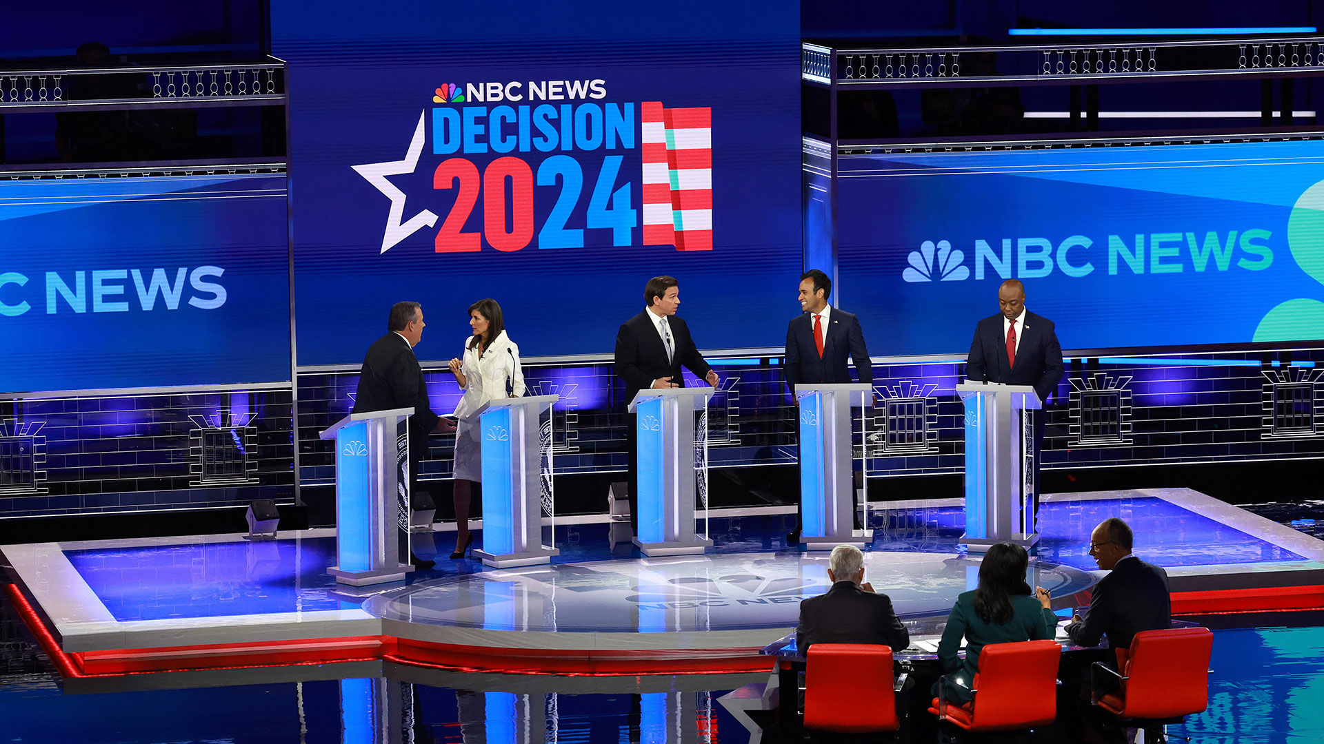 It says 'NBC News: Decision 2024,'
the word 'decision' and the '24' are in blue, the '20' is in red.
