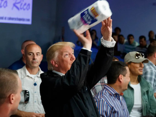 Trump basketball shoots a roll of paper towels to Puerto Ricans after a hurricane