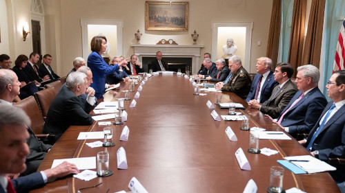 Pelosi stands and points at Trump during a meeting in the Cabinet Room