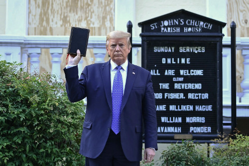 Trump holds up the Bible