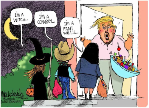 Trump drops the Halloween candy when 
a kid in a Fani Willis costume shows up at his front door.