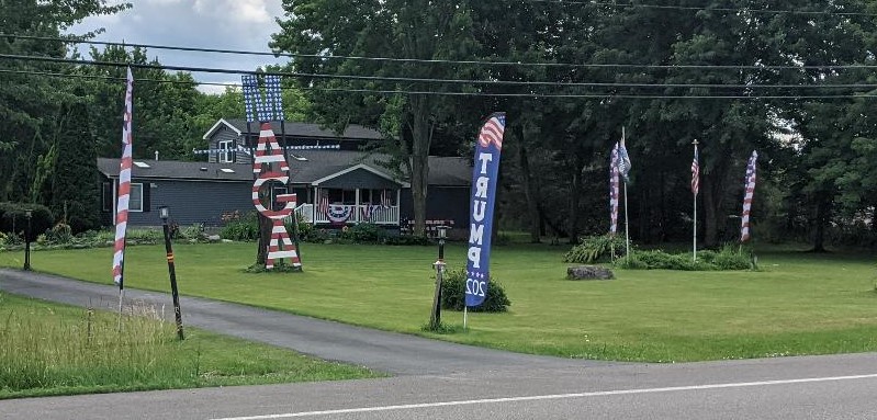 A fairly nice, Cape Cod-style
house, with multiple Trump signs