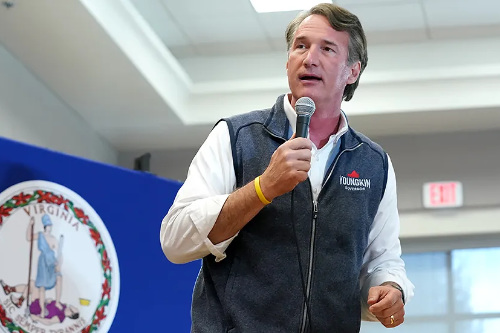 Glenn Youngkin in a fleece vest with his logo in the left upper chest area