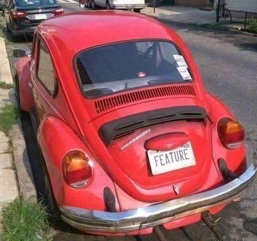 A Volkswagen Bug with the license plate 'Feature'