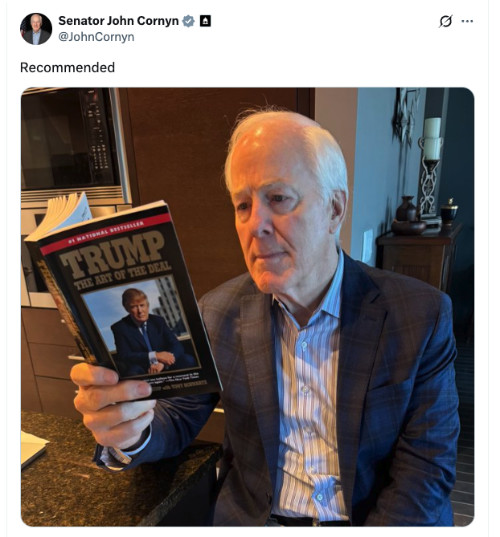 A picture of Cornyn
reading Trump's book 'The Art of the Deal' with the comment 'Recommended.'