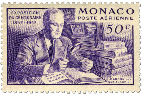 A stamp from Monaco that portrays FDR 
pasting stamps into a display book