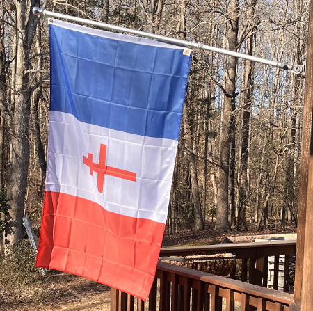 Tricolor flag with a Catholic
cross on it
