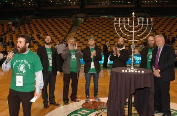 A sports arena, and a menorah; lots of green and white is visible