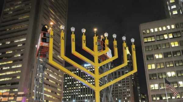A large yellow, menorah; the letters on it are just barely visible, and spell out b-a-l-t...