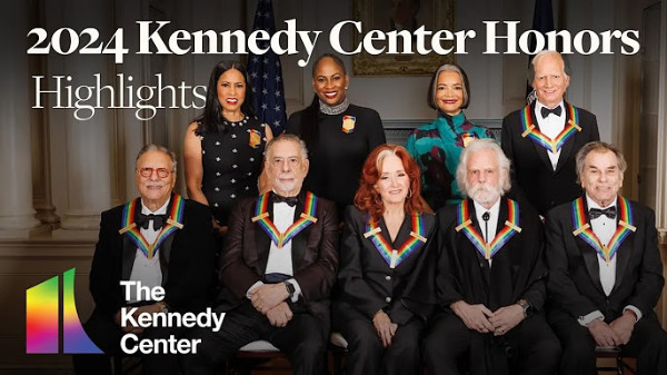 11 people, among them Francis Ford Coppola, Andrew Lloyd Webber and Bonnie Raitt, wearing medallions with rainbow ribbons