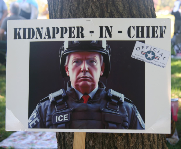 An AI-generated picture of Donald Trump in
an ICE uniform, with the title 'KIDNAPPER IN CHIEF.'