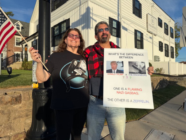 The sign asks 'What
is the difference between Donald Trump and the Hindenburg' and answers 'One is a flaming gasbag, and the other is
a Zeppelin.'